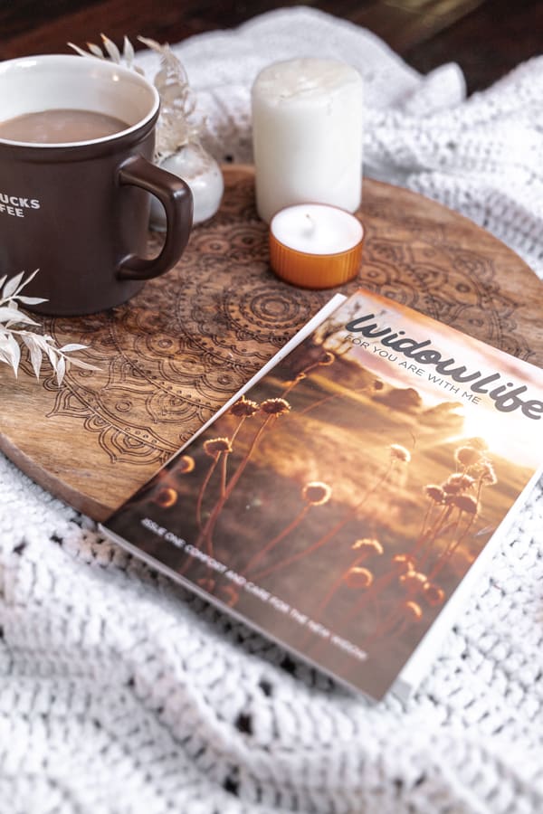 WidowLife magazine on floor with candles and coffee